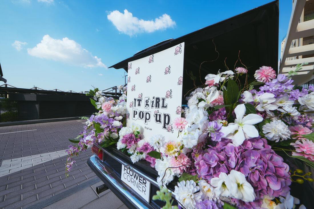 Flower Corner's classic wedding car dressed with fresh flowers